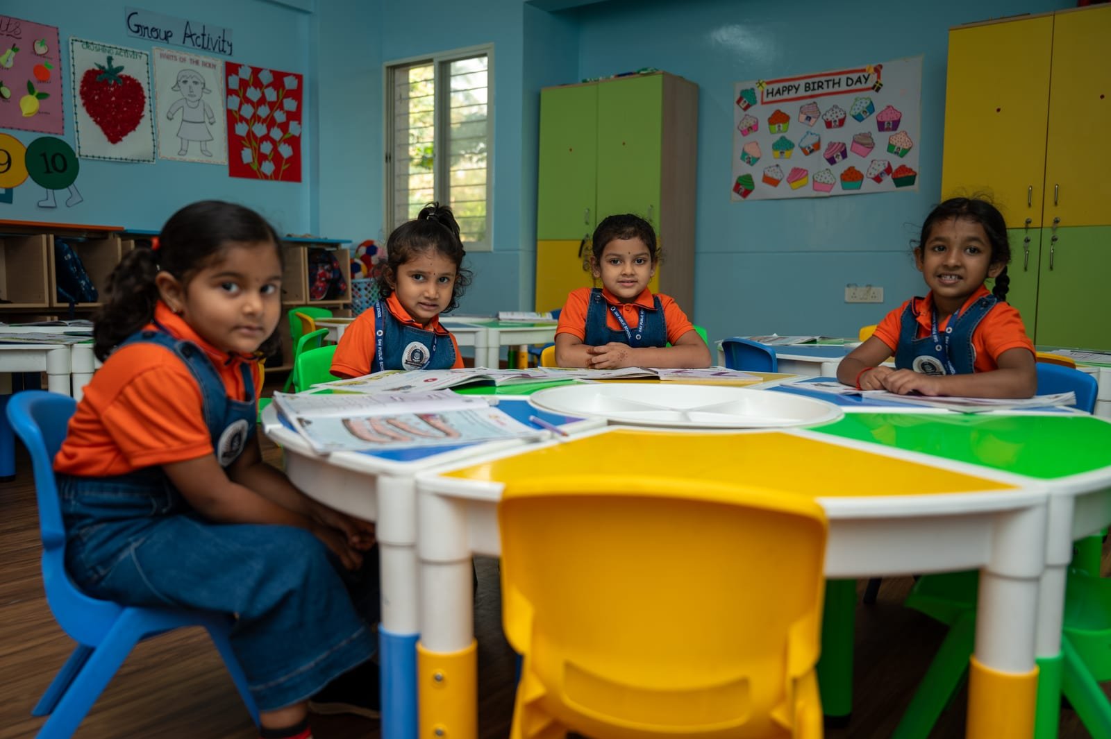 DAV pre-primary students in a colorful classroom